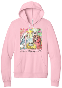 Adore Him Painted Nativity hoodie in Pink, featuring a watercolor nativity of Mary, Joseph, and baby Jesus under a star with Oh Come Let Us Adore Him script