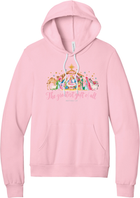 The Greatest Gift of All hoodie in Pink, featuring a pastel watercolor nativity scene under the star with The Greatest Gift of All script and Matthew 1:21