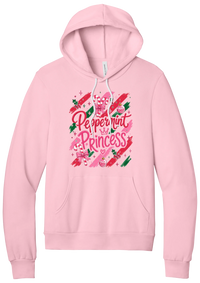 Peppermint Princess hoodie in Pink, featuring pink Peppermint Princess script with candy canes, a crown, and bows on red and green brush strokes