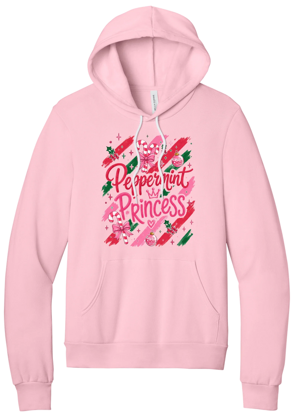 Peppermint Princess hoodie in Pink, featuring pink Peppermint Princess script with candy canes, a crown, and bows on red and green brush strokes