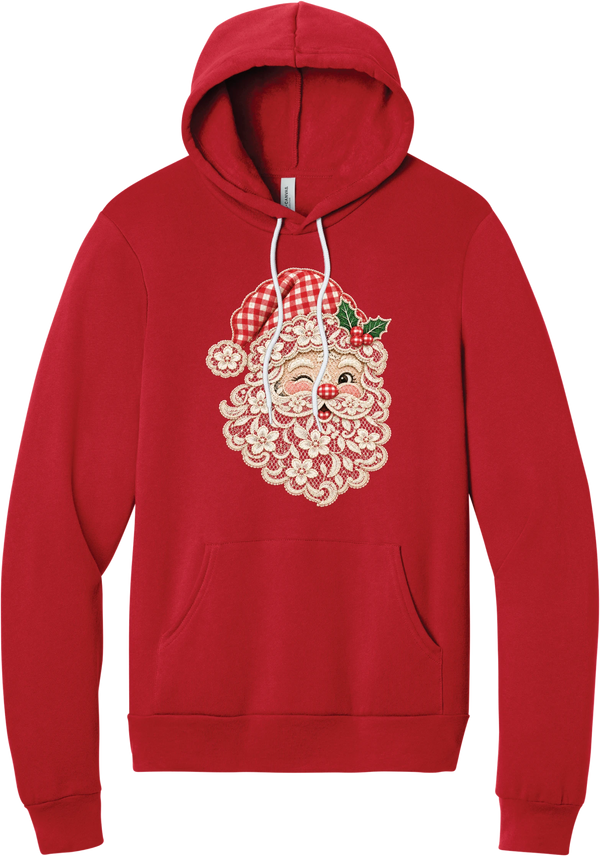 Vintage Lace Santa hoodie in Red, featuring a winking Santa face in a vintage lace-look print with a cream floral beard, red gingham hat, and holly