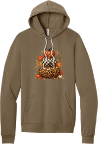 All Stacked Up hoodie in Vintage Brown, featuring three stacked pumpkins in polka dot, checkerboard, and leopard with autumn leaves