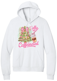 Jolly and Caffeinated hoodie in White, featuring a pink bow Christmas tree and an iced coffee with Jolly and Caffeinated script