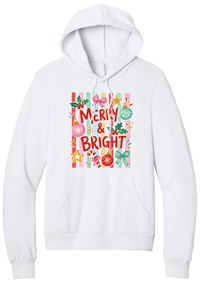 Merry and Bright Striped hoodie in White, featuring red MERRY and BRIGHT letters on pink and green stripes with ornaments and holly
