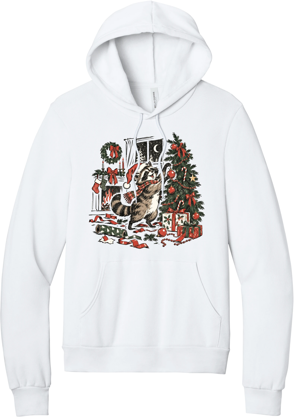 Raccoon Christmas hoodie in White, featuring a vintage-style raccoon in a Santa hat and plaid scarf decorating a Christmas tree by the fireplace with ribbon and gifts scattered around