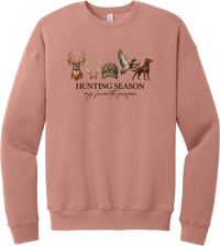 Hunting Season crewneck sweatshirt in Mauve, featuring a whitetail buck, antlers, a camo cap, a flying mallard, and a chocolate lab above Hunting Season My Favorite Season lettering