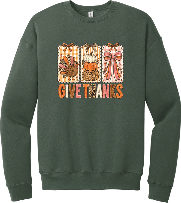 Give Thanks Coquette crewneck sweatshirt in Military Green, featuring three bow-topped stamp panels with a turkey, stacked pumpkins, and a pink bow above Give Thanks in patchwork letters