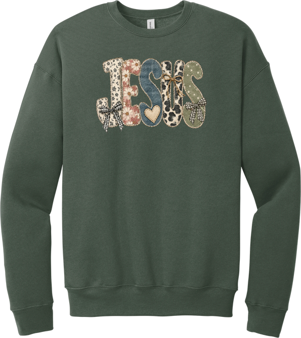 Jesus Patchwork crewneck sweatshirt in Military Green, featuring JESUS in patchwork letters of floral, leopard, denim, and cow print with gingham bows and a heart