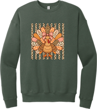 Preppy Turkey crewneck sweatshirt in Military Green, featuring a smiling turkey with gingham and leopard feathers and a pink bow on a leopard stripe background