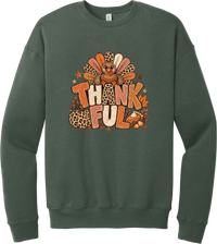 Thankful Leopard Turkey crewneck sweatshirt in Military Green, featuring a leopard and plaid feathered turkey over the word Thankful, with a leopard pumpkin, pie, and autumn leaves