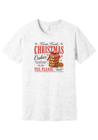 Farm Fresh Christmas Cookies tee in Ash, featuring a vintage farmhouse bakery sign with a stack of Christmas cookies tied in a red ribbon bow