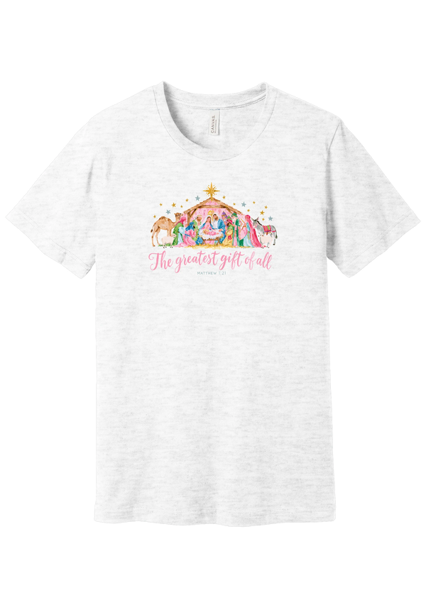 The Greatest Gift of All tee in Ash, featuring a soft watercolor nativity scene beneath the star with Matthew 1:21