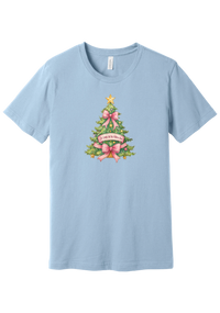 Adore Him Bow Tree tee in Baby Blue, featuring a green Christmas tree dressed in pink bows and a gold star with an Oh Come Let Us Adore Him banner