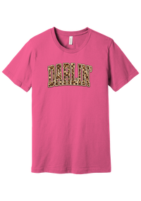 Darlin' tee, Leopard Checker design, in Charity Pink, featuring arched varsity DARLIN' letters filled with leopard and checker print