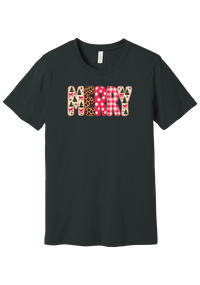 Merry Preppy Applique tee in Dark Grey, featuring faux applique MERRY letters in pink and green patchwork patterns with trees, gingham, Santas, polka dots, and candy cane stripes