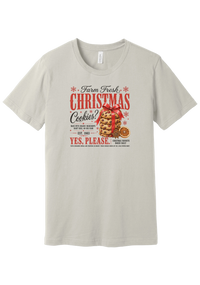 Farm Fresh Christmas Cookies tee in Dust, featuring a vintage farmhouse bakery sign with a stack of Christmas cookies tied in a red ribbon bow