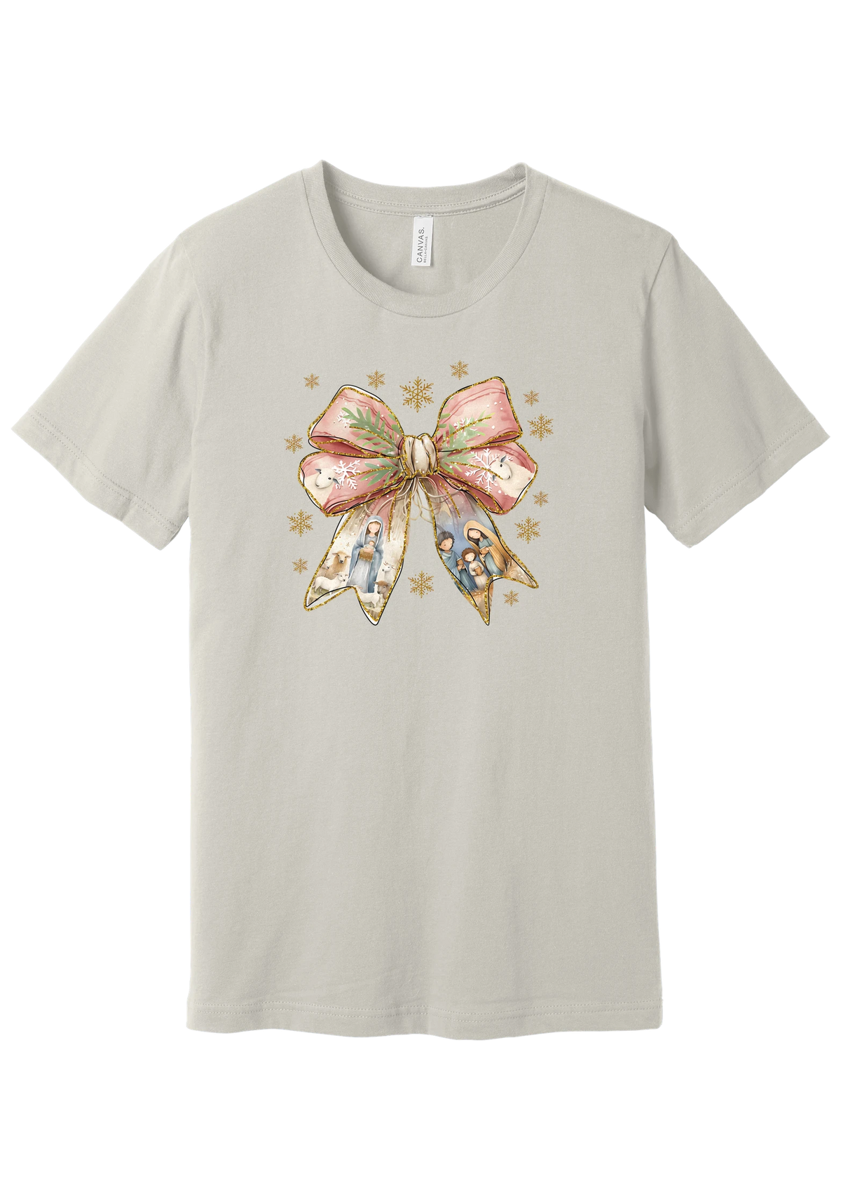 Nativity Bow tee in Dust, featuring a blush satin bow with painted nativity scenes in its ribbons and gold snowflakes