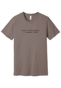 I Don't Hold Grudges tee in Pebble Brown, featuring I don't hold grudges, I remember facts in distressed black typewriter letters