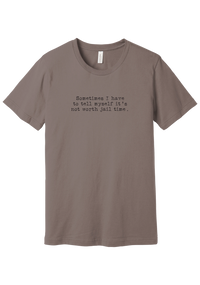 Not Worth Jail Time tee in Pebble Brown, featuring Sometimes I have to tell myself it's not worth jail time in distressed black typewriter letters