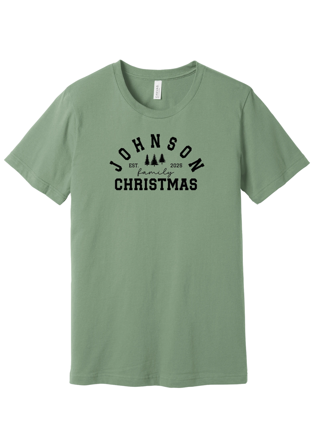 Personalized Family Christmas tee in Sage, featuring a personalized family last name arched over three pine trees with EST. and the year
