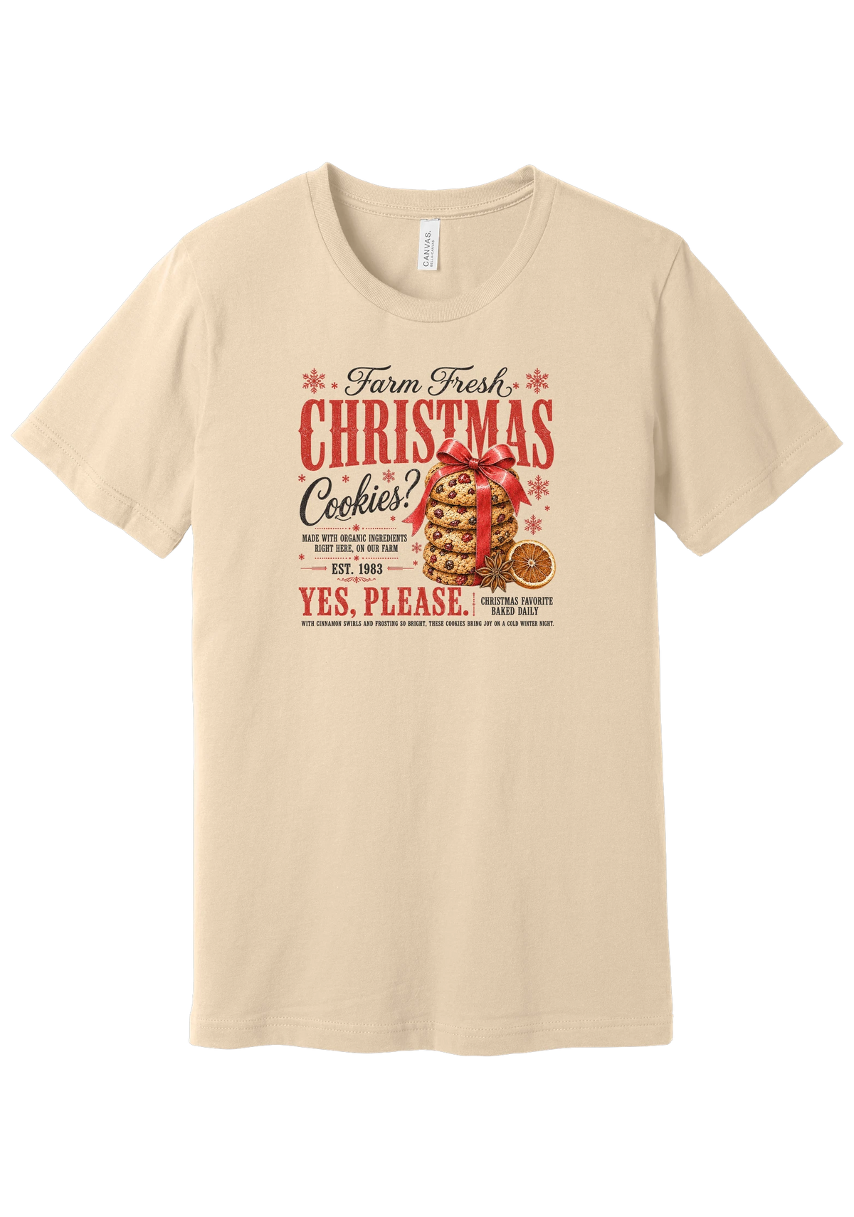 Farm Fresh Christmas Cookies tee in Soft Cream, featuring a vintage farmhouse bakery sign with a stack of Christmas cookies tied in a red ribbon bow