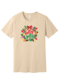 Holly Jolly Christmas Lights tee in Soft Cream, featuring hand-lettered holly jolly script framed by vintage bulb lights, holly, and a big red bow