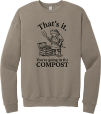 You're Going in the Compost crewneck sweatshirt in Tan, featuring a grumpy frog gardener in overalls holding a pitchfork beside a compost bin with That's it. You're going in the COMPOST