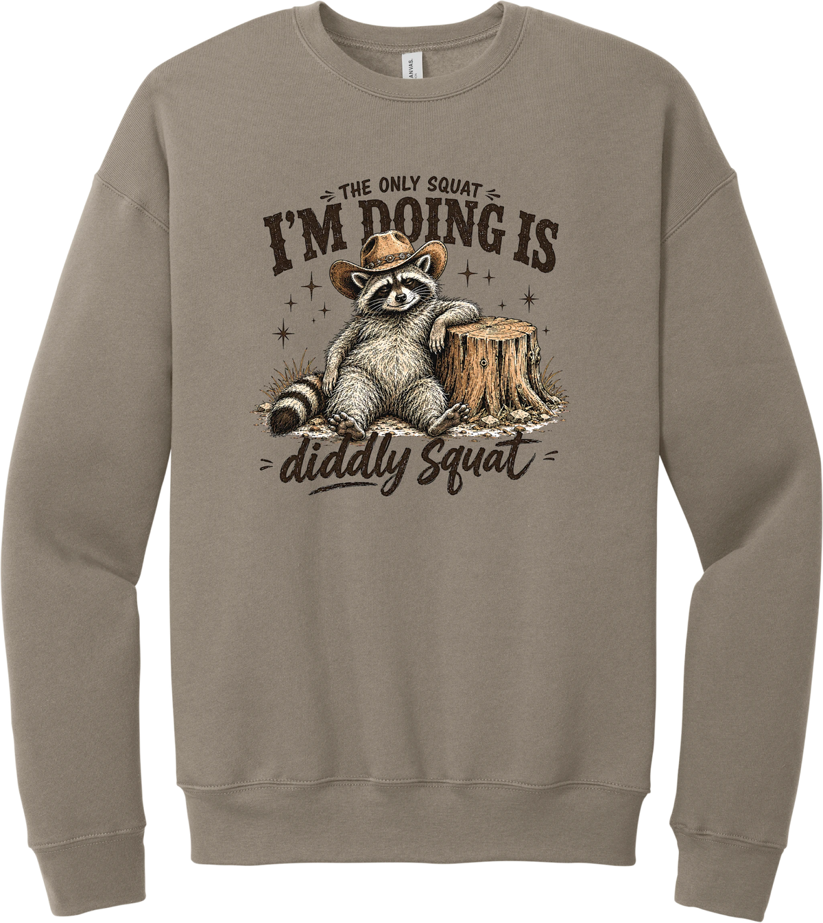 Diddly Squat crewneck sweatshirt in Tan, featuring a cowboy raccoon lounging against a tree stump with The only squat I'm doing is diddly squat