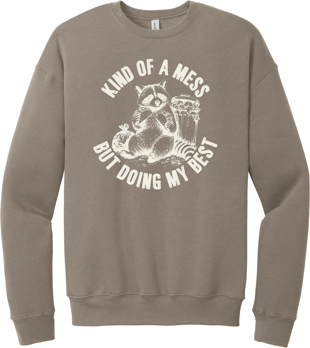 Kind of a Mess But Doing My Best crewneck sweatshirt in Tan, featuring a raccoon sitting beside a trash can with Kind of a mess but doing my best
