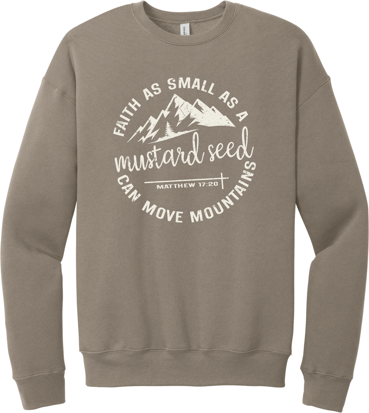 Mustard Seed Faith crewneck sweatshirt in Tan, featuring a circle badge of mountains and a cross with Faith as Small as a Mustard Seed Can Move Mountains lettering and Matthew 17:20