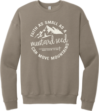 Mustard Seed Faith crewneck sweatshirt in Tan, featuring a circle badge of mountains and a cross with Faith as Small as a Mustard Seed Can Move Mountains lettering and Matthew 17:20