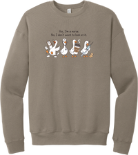 Yes I'm a Nurse Goose crewneck sweatshirt in Tan, featuring four nurse geese with a clipboard, stethoscope, coffee, and needle under Yes, I'm a nurse. No, I don't want to look at it.