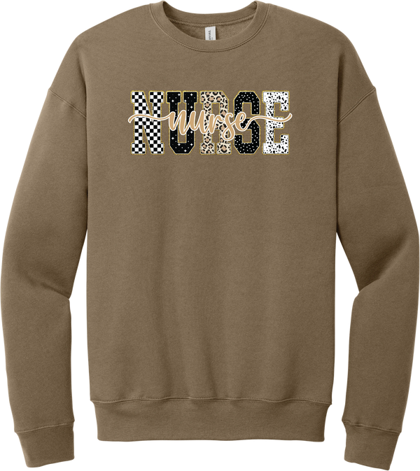 Glitzy Patterned Nurse crewneck sweatshirt in Vintage Brown, featuring NURSE block letters in checkerboard, leopard, and polka dot patterns with a gold glitter outline and nurse script