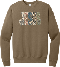 Jesus Patchwork crewneck sweatshirt in Vintage Brown, featuring JESUS in patchwork letters of floral, leopard, denim, and cow print with gingham bows and a heart