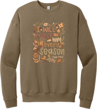 Praise Him Wildflower crewneck sweatshirt in Vintage Brown, featuring I Will Praise Him in Every Season in hand lettering surrounded by fall wildflowers, pumpkins, a latte, boots, and Psalm 146:2